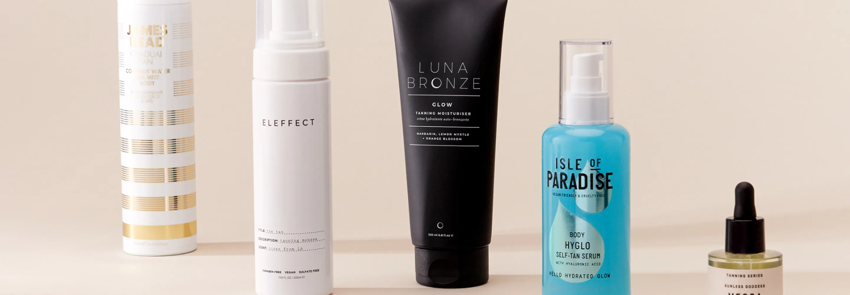 products lined up: james read gradual tan mist, eleffect the tan, luna bronze glow tanning moisturiser, isle of paradise body self tan serum and mecca cosmetica sunless goddess self tanning drops