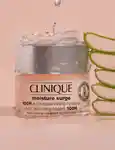 Clinique moisture surge next to sliced aloe vera