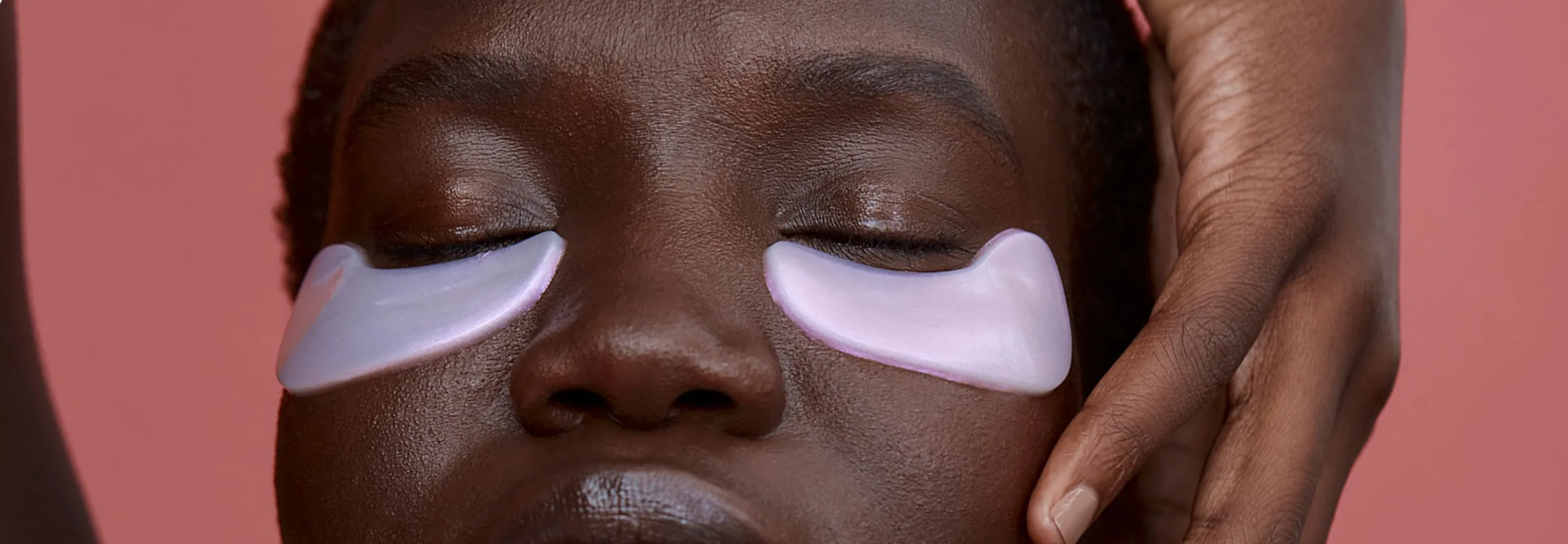 model with purple undereye masks on