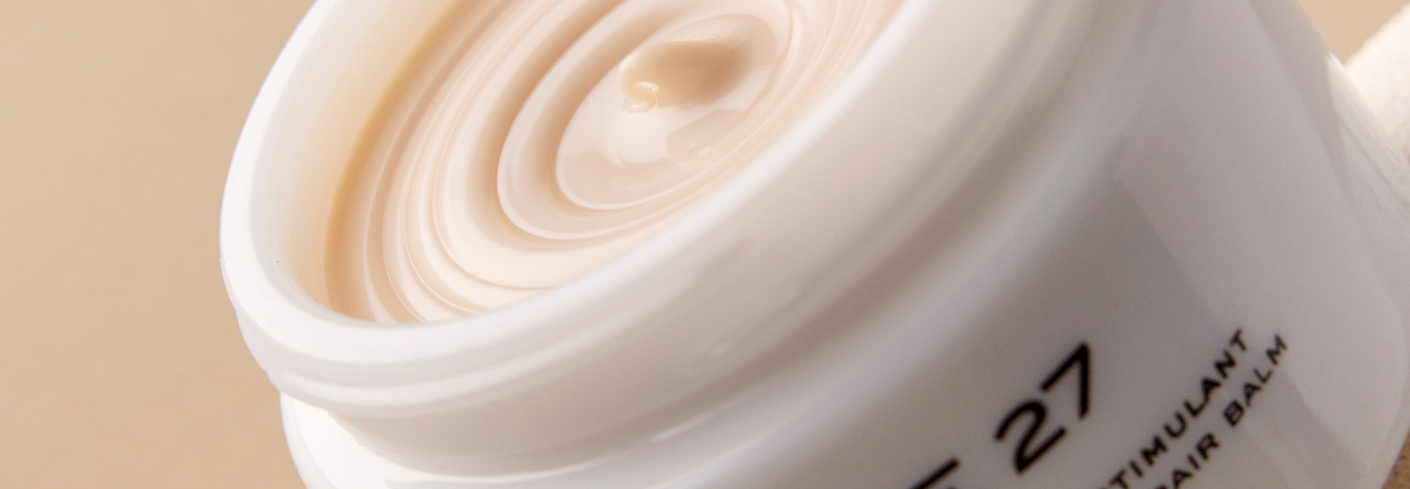 open jar of bosmetics 27 baume 27