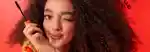 a model holding the mecca max eye max mega volume mascara