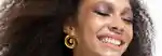 a model with smoky eyeshadow laughing