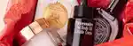 products in a mecca gift box: charlotte tilbury magic cream, officine universelle buly Eau Triple Mexican Tuberose Perfume, necessaire the body oil and diptyque orpheon edp