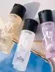 Bottles of the mac fix+ sprays  scattered on a table