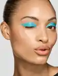 model with bright teal eyeshadow looking into the camera