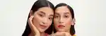 two models with pink eyeshadow looking at the camera
