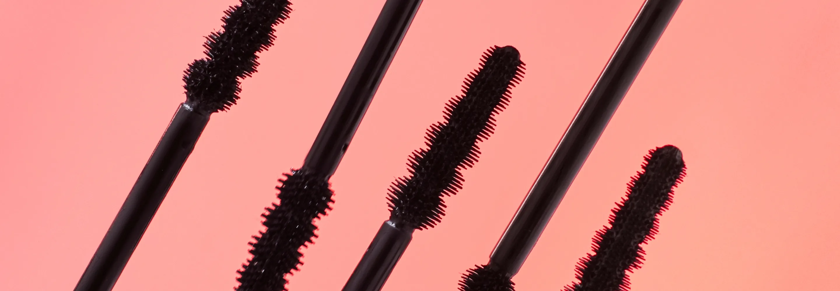 mecca max whip lash tubing mascara wands lined up next to each other
