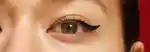 closeup of a model's eye with black winged eyeliner