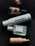 Flat lay of a range of beauty products on a black background