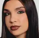 A close up of a face wearing brown matte eyeshadow