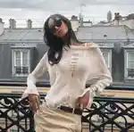 A person reclining on a balcony