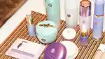 Shot of Tatcha skincare products laid out on a makeup artist's bench.