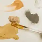 Skincare oils, serums and powders on a white background.