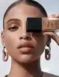 Image of model holding nars foundation