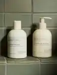 Sans Ceuticals Hair Wash and Hair Hydrant on bathroom tiles