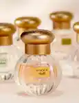 Close up of Tocca Estelle EDP with other Tocca fragrances in the background